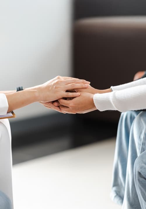 psychologist-holding-hands-provide-assistance-understanding-problems-woman-patient