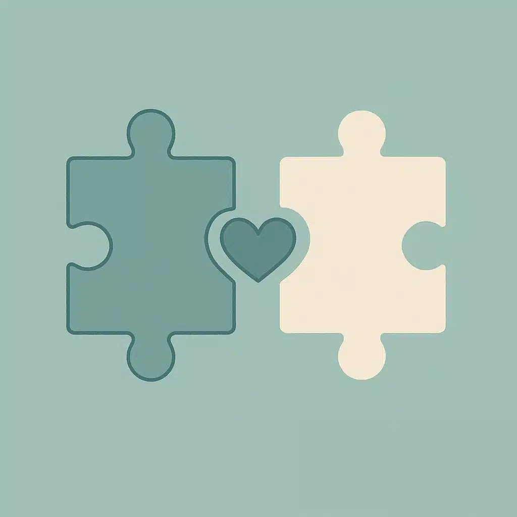 Two puzzle pieces connecting, symbolizing therapist-client connection.